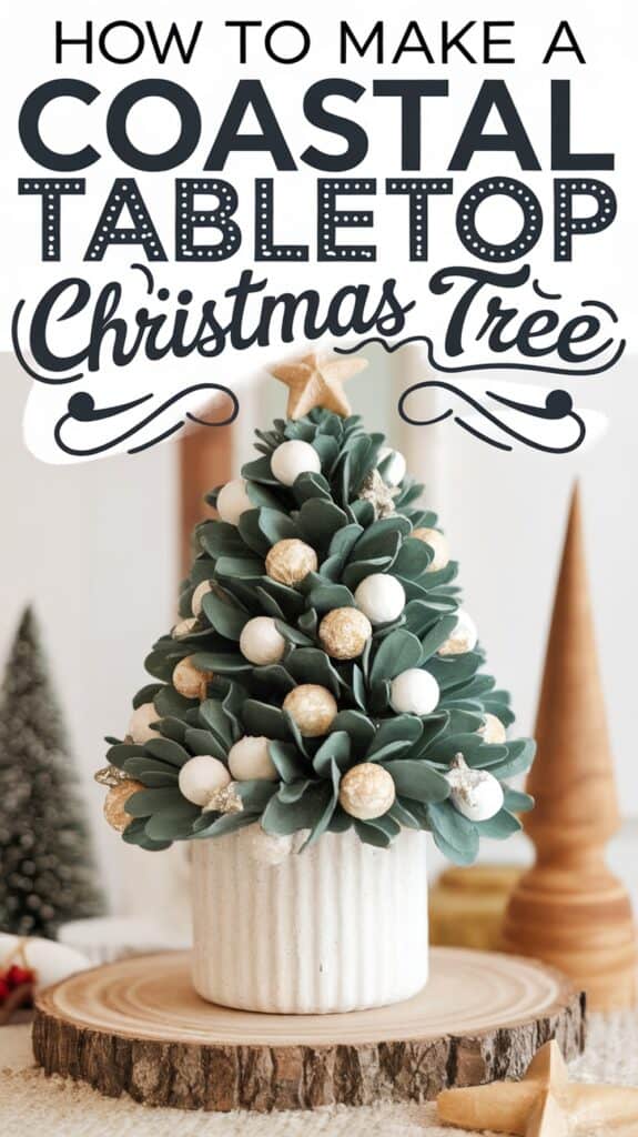 A small tabletop Christmas tree decorated with white and golden ornaments sits on a wooden slab, positioned in a white ribbed pot. The image includes text at the top reading "How to Make a Coastal Tabletop Christmas Tree." In the background, blurred objects suggest a festive, coastal-themed setting.
